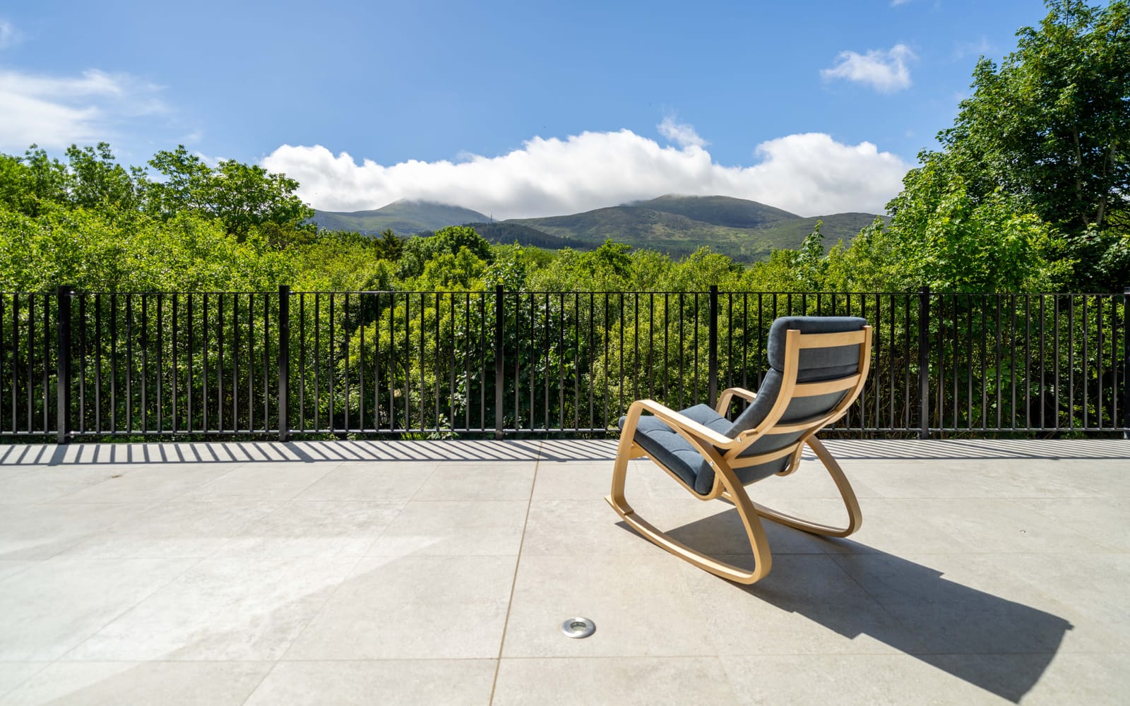 A rocker on the terrace, the Mournes beyond